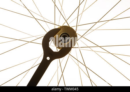 Close-up of wrench and bicycle spokes of bike wheel Stock Photo