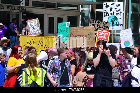 Young people lobby for action to prevent climate change at the  Manchester Youth Strike 4 Climate protest on June 21, 2019, in Manchester, uk. The group marched from St Peter's Square in the city centre to the University of Manchester. One of their demands is for the University to divest itself of investments in fossil fuels.