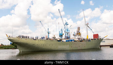 Bremerhaven, Germany. 21st June, 2019. The naval training sailing ship 'Gorch Fock' is undocked from a dock of the Bredo shipyard. The naval training ship 'Gorch Fock' is being launched in Bremerhaven today after more than three years in the dock. Credit: Mohssen Assanimoghaddam/dpa/Alamy Live News Stock Photo