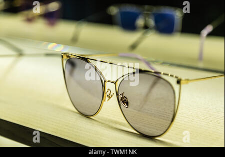 fashion metal sun glasses display on table Stock Photo