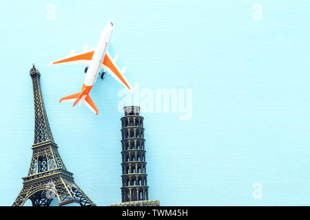 holidays. Top view banner photo of traveling concept with accessories and world symbols over blue background Stock Photo