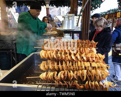 A street-vendor in Prague, Czech Republic selling home-made potato chips at an open market on Old Town Square Stock Photo