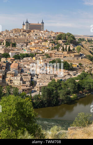 Toledo, Toledo Province, Castilla-La Mancha Spain.  Overall view of the historic centre showing the Tagus River (Rio Tajo) and the Alcazar.  Toledo is