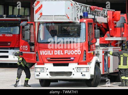 Rome, RM, Italy - May 23, 2019: red fire engine with ladder and platform with text VIGILI DEL FUOCO that means Firemen in Italian language Stock Photo