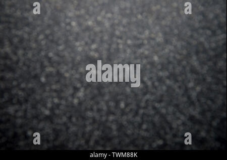 Dark defocused black background in textured gray tones Stock Photo