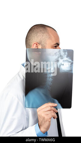 Funny portrait of a young doctor playing with a skull x-ray. isolated on white. Stock Photo