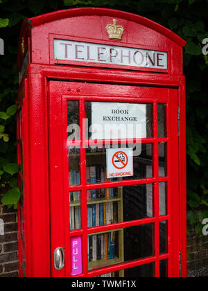 Book Exchange, Reusing Red Telephone Box, on the Ridgeway Trail, Streatley, Berkshire, England, UK, GB. Stock Photo