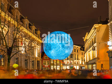 Long exposure photograph of the moon artwork installation by Luke Jerram in the historic city center of Ghent during the light festival, Belgium. Stock Photo