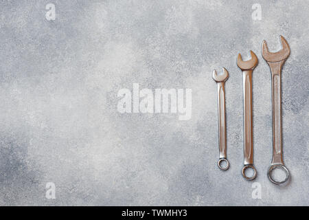 Wrenches, tools on gray concrete background with copy space Stock Photo