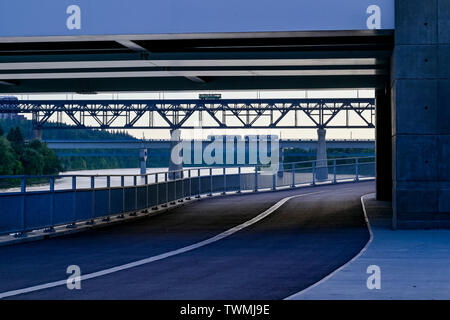 Modern Light Rail rapid transit railcars contrast with old streetcar atop High Level Bridge, Edmonton, Alberta, Canada Stock Photo