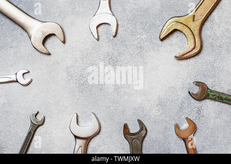 Wrenches, tools on gray concrete background with copy space Stock Photo