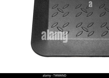 Black rubber mat with ornaments close up. Stock Photo