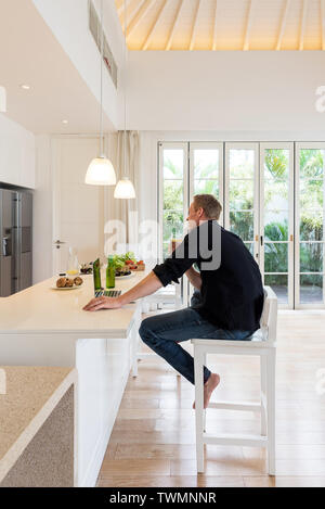 Couple having lunch on a island kitchen at home Stock Photo