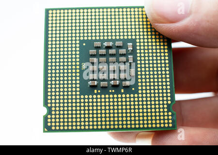 Realistic cpu back view processor chip in hand Stock Photo