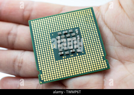 Realistic cpu back view processor chip in hand Stock Photo