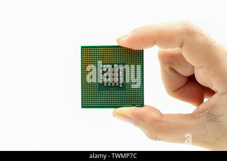 Realistic cpu back view processor chip in hand on white background Stock Photo
