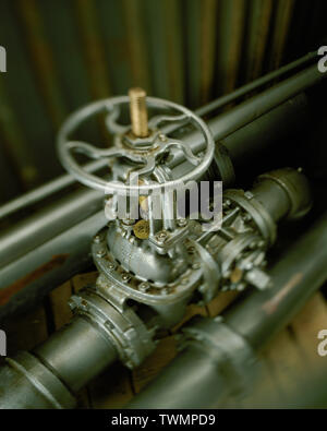 Industrial valve used to control flow of liquids or gases in chemical, petrochemical or manufacturing plants Stock Photo
