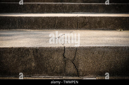 Broken old concrete staircase with cracked background texture Stock Photo