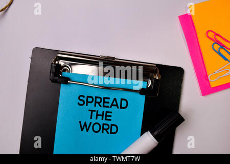 Spread the Word on sticky notes isolated on white background. Stock Photo