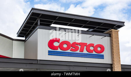 MOORESVILLE, NC, USA-JUNE 19, 2019: The COSTCO logo on the front exterior of a local store. Stock Photo