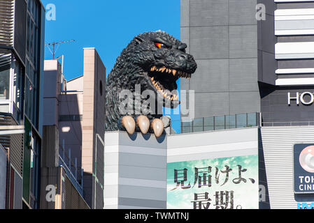 TOKYO - DEC 30: Head of Godzilla Doll at  Shinjuku District in Tokyo on December 30. 2016 in Japan Stock Photo