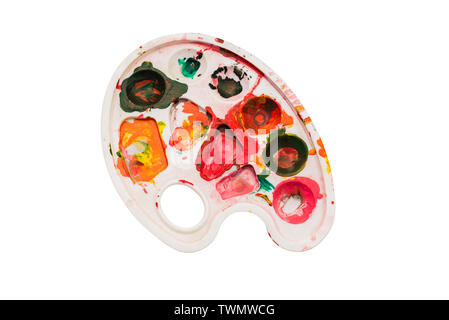 Palette with paints on a white background. Multi-colored spots of paint on the palette. The concept of drawing, art, creativity. Art tools Stock Photo