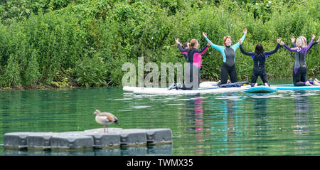 Upminster, Essex, UK. 21st June 2019. A new wellness initiative was launched today by Yogactive: Stand up Paddleboard Vinyasa yoga held at Stubbers Adventure Centre Upminster Essex Credit Ian Davidson/Alamy Live News Stock Photo