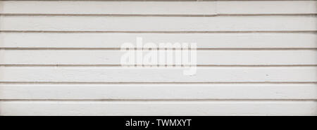 Full frame background of a clean wood board wall painted in white. Copy space. Stock Photo