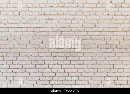 High resolution full frame background of detailed old pale brick wall. Stock Photo