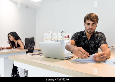 Creative business team working in coworking office Stock Photo