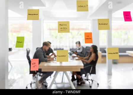 Group of young entrepreneurs working toghether in a coworking space Stock Photo