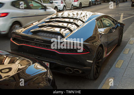 Paris, France - July 06, 2018: Black Lamborghini parked near the hotel on the central streets of Paris Stock Photo