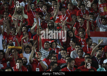 Cairo, Egypt. 21st June, 2019. Egyptian fans celebrate in the stands during the 2019 Africa Cup of Nations Group A soccer match between Egypt and Zimbabwe at the Cairo International Stadium. Credit: Omar Zoheiry/dpa/Alamy Live News Stock Photo
