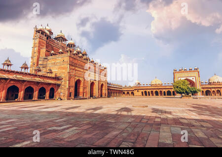 Fatehpur Sikri Agra medieval architecture with view of giant red sandstone gateway known as Buland Darwaza built by Mughal Emperor Akbar Stock Photo
