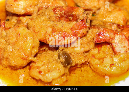 Spicy tasty Indian shrimp (prawn) food prepared in gravy curry served as side dish in close up macro view Stock Photo