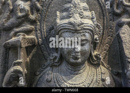 Ancient stone sculpture of Indian God 'Vagisvari' made of Basalt rock from fifth century common era Stock Photo