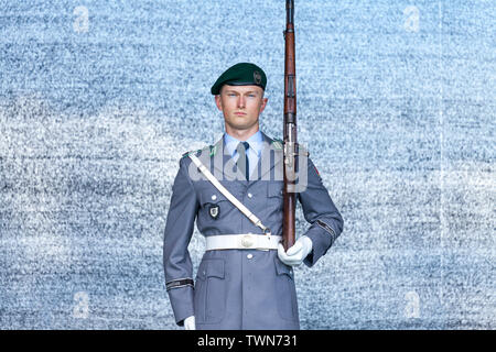 AUGUSTDORF / GERMANY - JUNE 15, 2019: German soldier from the guard battalion walks on a stage at Day of the Bundeswehr 2019. Stock Photo
