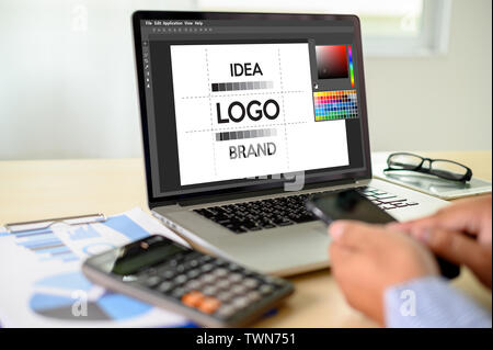 Creative Designer Graphic at work. , Illustrator Graphic designer working digital tablet and computer Color swatch samples Stock Photo