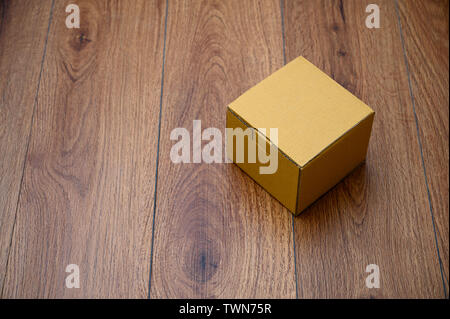 box empty open cardboard box on wooden surface with empty space top Flat lay Stock Photo