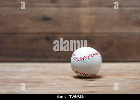 baseball on Abstract background and red stitching baseball. White baseball with red thread.Baseball is a national sport of Japan. It is popular. Stock Photo