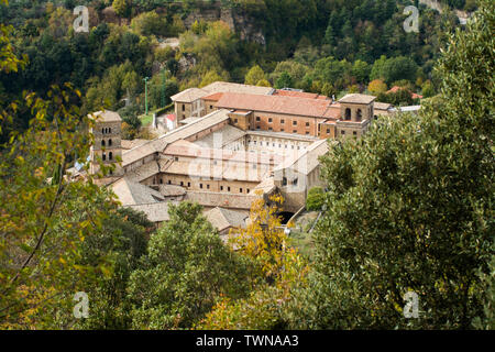 View of Saint Scholastica medieval monastery surrounded, by trees in Subiaco. Founded by Benedict of Nursia Stock Photo