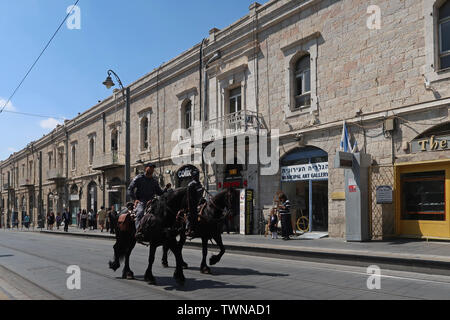 Israeli Policemen from the cavalry unit mounted on horses patrolling along Jaffa road the longest and oldest major street in downtown West Jerusalem Israel Stock Photo