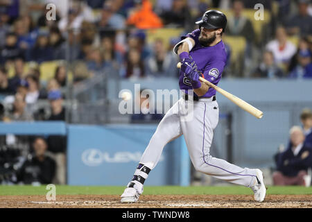 Los Angeles, CA, USA. 21st June, 2019. Colorado Rockies left fielder David Dahl (26) makes contact at the plate during the game between the Colorado Rockies and the Los Angeles Dodgers at Dodger Stadium in Los Angeles, CA. (Photo by Peter Joneleit) Credit: csm/Alamy Live News Stock Photo