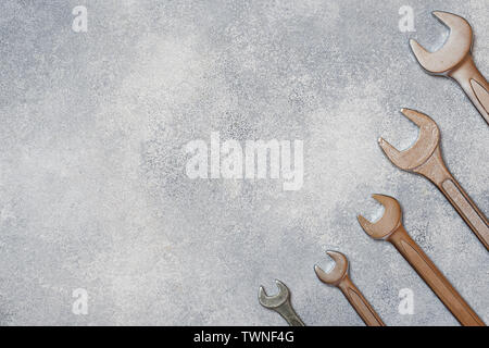 Wrenches, tools on gray concrete background with copy space Stock Photo