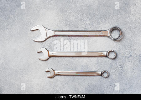 Wrenches, tools on gray concrete background with copy space Stock Photo