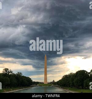 Beijing, USA. 20th June, 2019. Photo taken with a mobile phone shows the Washington Monument under the clouds in Washington, DC, the United States, June 20, 2019. Credit: Liu Jie/Xinhua/Alamy Live News Stock Photo