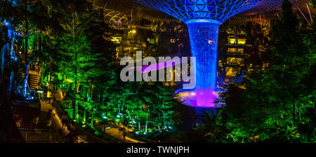 Singapore - Jun 18,  2019: HSBC Rain Vortex at night. Jewel Changi Airport is a mixed-use development at Changi Airport in Singapore. Stock Photo