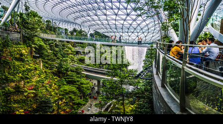 Singapore - Jun 11,  2019: HSBC Rain Vortex. Jewel Changi Airport is a mixed-use development at Changi Airport in Singapore, opened in April 2019. Stock Photo