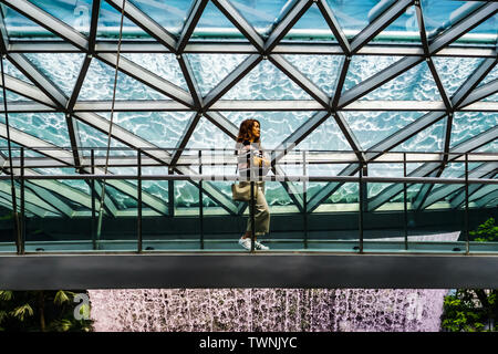 Singapore - Jun 11,  2019: HSBC Rain Vortex. Jewel Changi Airport is a mixed-use development at Changi Airport in Singapore, opened in April 2019. Stock Photo