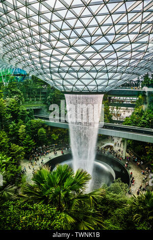 Singapore - Jun 11,  2019: HSBC Rain Vortex. Jewel Changi Airport is a mixed-use development at Changi Airport in Singapore, opened in April 2019. Stock Photo